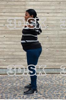 Older black woman whole body sweater deep blue jeans photo…